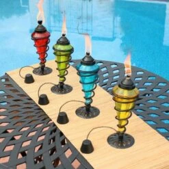 Best deal ❤️ Sunnydaze Decor Sunnydaze Outdoor Tabletop Glass and Metal Swirl Patio Table and Lawn Citronella Torch Set - Blue, Red, Green, and Yellow - 4pc ✨